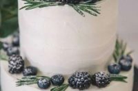 41 a simple white buttercream wedding cake decorated with rosemary and fresh berries is a stylish idea for a winter wedding