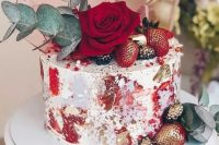 42 a unique wedding cake with red brushstrokes and gold leaf, gilded berries, a red rose, eucalyptus and pink sugar shards