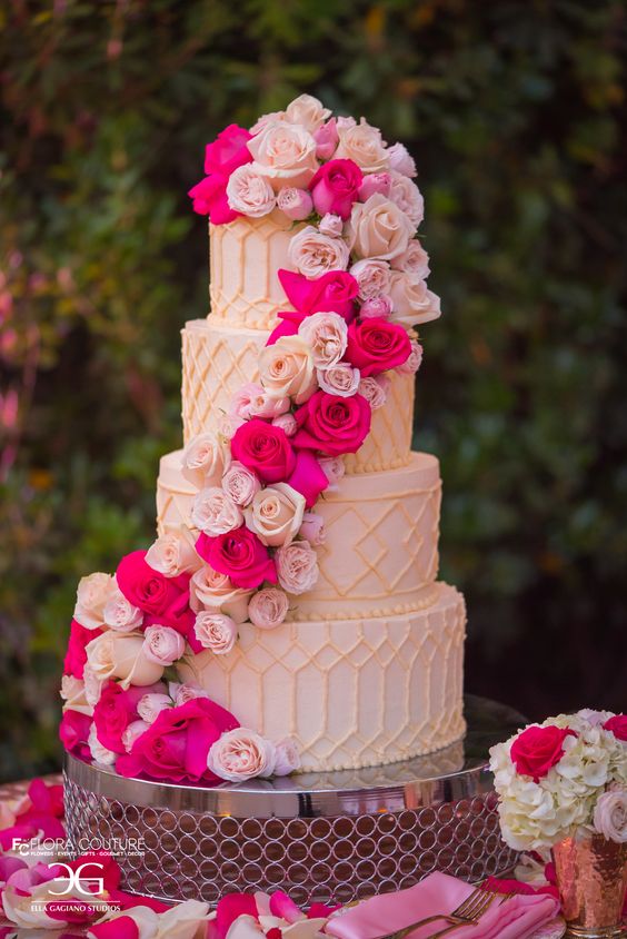 a refined patterned wedding cake with blush, lilac and hot pink roses is a gorgeous and statement idea for a glam and vintage-infused wedding