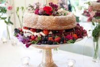48 a bundt wedding cake filled with whipped cream, with bold blooms and fresh berries is a fab idea for a summer wedding and can be used for a fall one, too