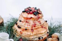 53 a crepe wedding cake with berry sauce and fresh berries and fruit on top is a lovely idea for a decadent fall wedding
