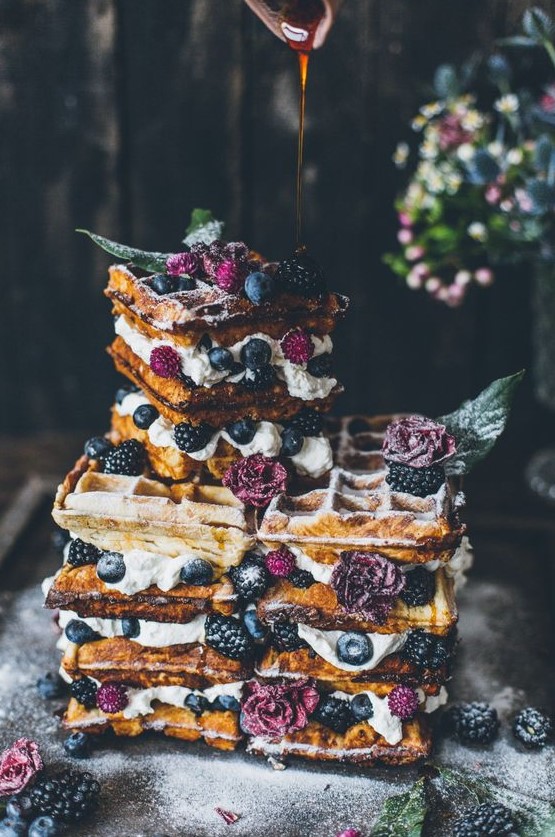 a gorgeous summer boho waffle wedding cake with blueberries and blackberries plus purple blooms and some caramel