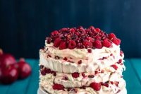 59 a pretty pavlova wedding cake with fresh raspberries and pomegranate seeds is a delicious wedding cake alternative
