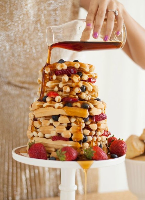 a waffle wedding cake with blueberries, strawberries and caramel on top is delicious and tasty