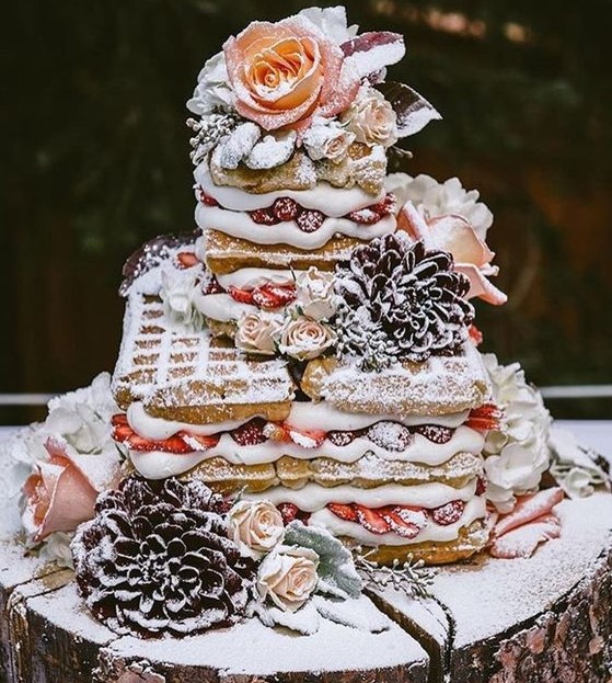 a yummy waffle wedding cake with fresh berries, blooms and sugar powder is very lovely