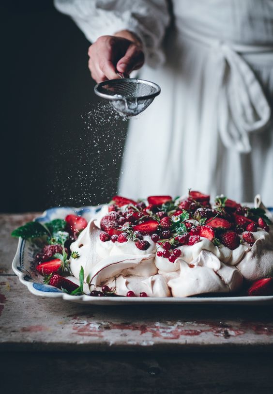 a gorgeous summer berry pavlova wedding cake with fresh mint and berries is amazing for a summer celebration