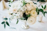 a lovely lush centerpiece for a wedding