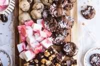 a cookie platter with chocolate with nuts, fudge, cookies with chocolate chip, chocolate dip is a lovely idea for a wedding