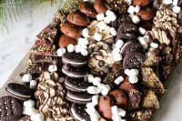 a gorgeous gluten free dessert board using tons of delicious store bought gluten free cookies and desserts, lots of chocolate and marshmallows is amazing