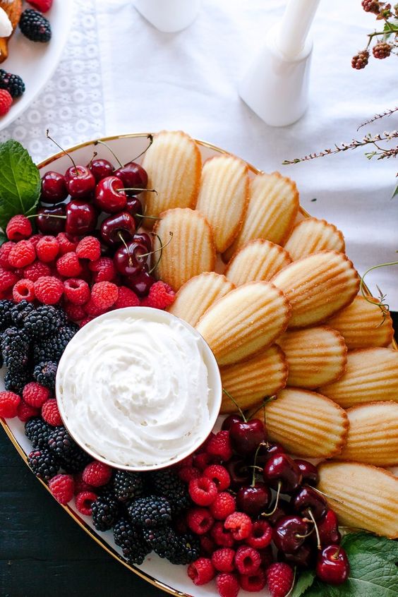 a small yet fantastic mini wedding dessert board with cookies, fresh berries and a creamy dip is amazing