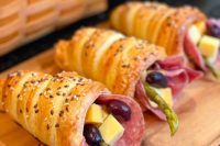 delicious edible bread charcuterie cones with olives, cheese, asparagus and ham and salami are amazing for a laid-back wedding
