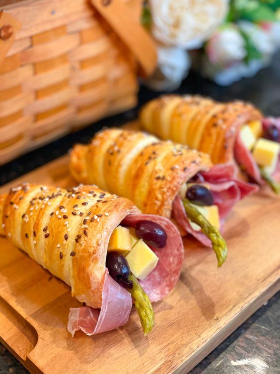 delicious edible bread charcuterie cones with olives, cheese, asparagus and ham and salami are amazing for a laid back wedding