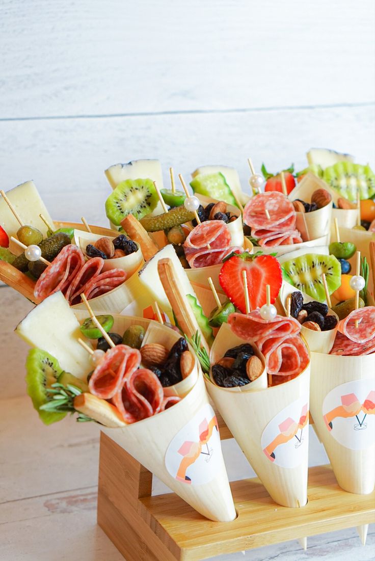 pretty and delicious grazing cups of cardboard, with fresh fruit and nuts, salami and cheese are perfect for any wedding