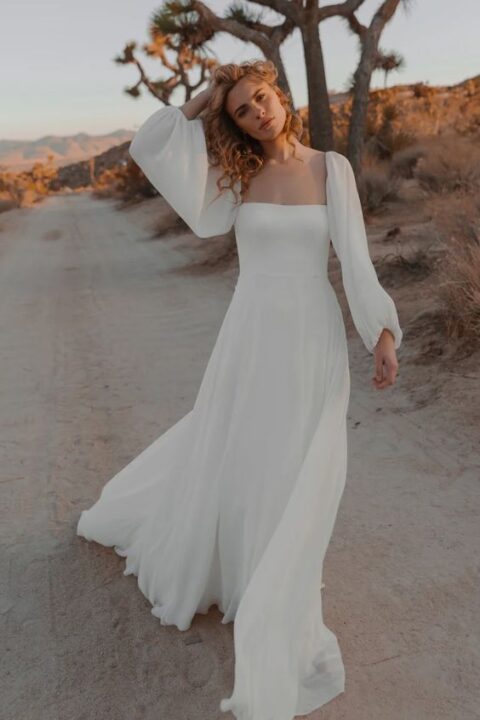 a beautiful and flowy A-line plain wedding dress with a square neckline and puff sleeves, a flowy skirt with a train will make your look dreamy and romantic
