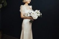 15 a dreamy vintage-inspired bridal look with a silk mermaid dress, sheer puff sleeves and a train is a creative out of the box idea