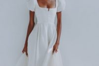 a beautiful A-line plain wedding dress with a square neckline and puff sleeves for a modern romantic bride