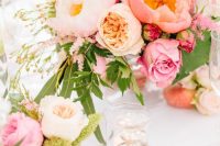 a chic pink wedding centerpiece of pink peonies, roses and peony roses, greenery is a beautiful solution for a wedding