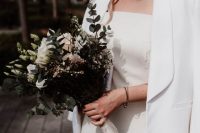 a minimalist creamy off the shoulder mini dress, a white blazer, a birdcage veil is a lovely idea for a modern Parisian wedding