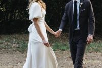 a refined modern plain A-line wedding dress with a square neckline, puff sleeves and a train is a lovely idea