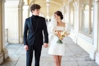 a trendy mini wedding dress – a plain one with oversized puff sleeves, neutral shoes and a cool updo for a retro-inspired look