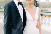 an ultra-modern plain A-line wedding dress with a covered plunging neckline, no sleeves is a lovely and chic idea for a modern wedding
