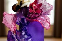 04 a jaw-dropping bold purple wedding cake with sugar waves around, some jewel-toned and dark blooms is wow for a fall wedding