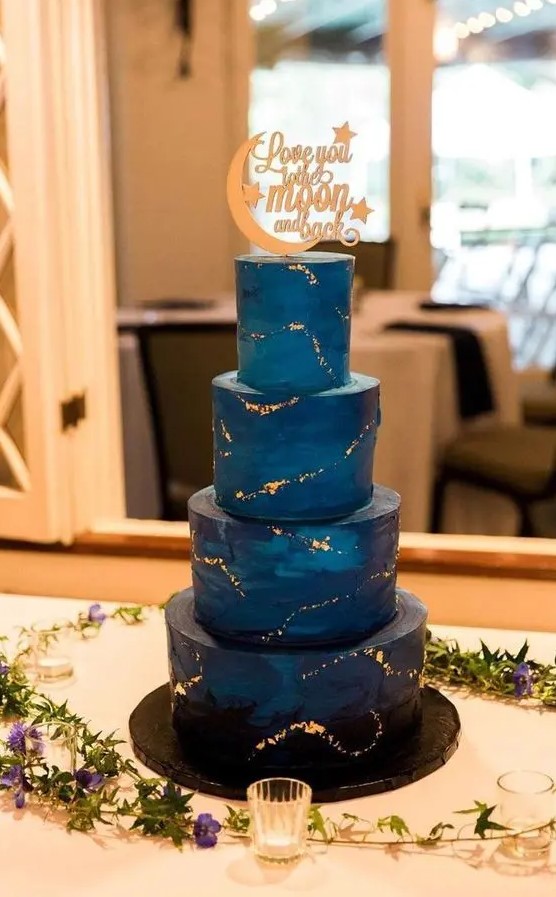 a navy and midnight blue wedding cake with gold stars inspired by the Starry Night by Van Gogh is amazing for a wedding