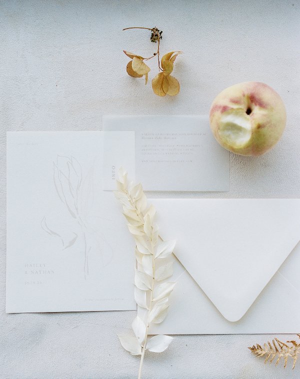 a delicate neutral wedding invitation suite with ethereal prints and modern lettering for a modern fall wedding