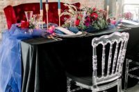 19 a wedding tablescape done with jewel-tone candles, a bright table runner, bold blooms and greenery for a rock-n-roll wedding