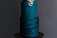 20 a sophisticated navy blue wedding cake with textural tiers, gold leaf and blush blooms is a very chic and very stylish idea for a modern wedding