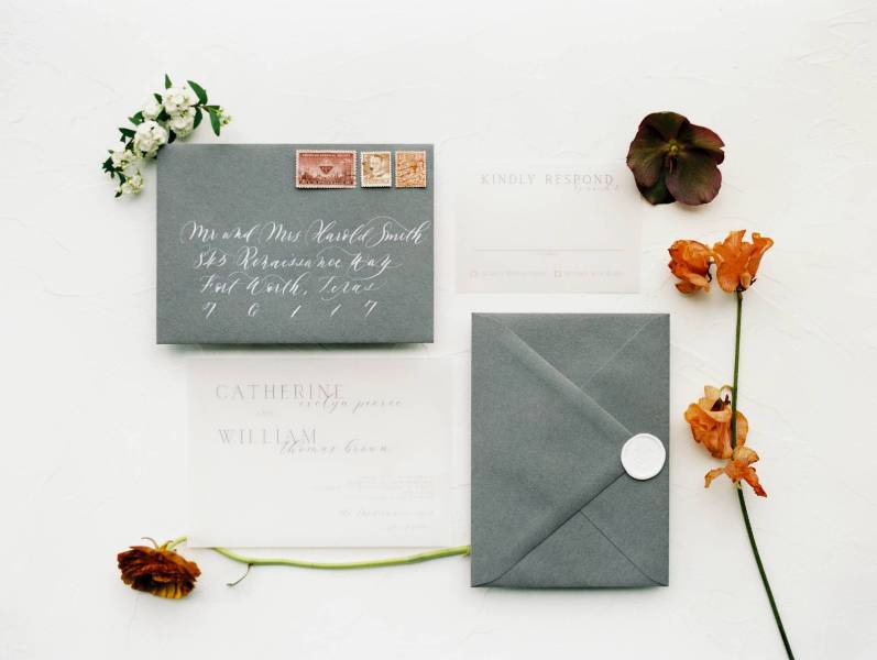 a stylish minimalist fall wedding invitation suite in graphite grey and white, with calligraphy and cool lettering