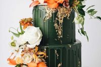 34 a gorgeous dark green wedding cake with matching drip and bold orange and white blooms and greenery looks jaw-dropping