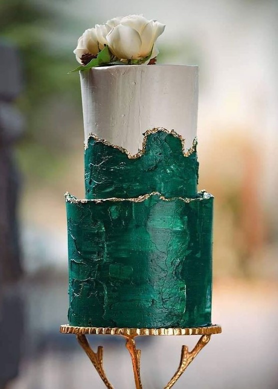a textural green wedding cake with gold leaf and white blooms on top is a refined and bold idea for a wedding