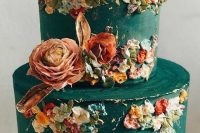 41 an artsy green wedding cake with sugar blooms that remind of Impressionism and bold blooms on top is breathtaking