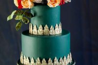 44 an emerald wedding cake with exquisite gold detailing, yellow, blush and red blooms, greenery and blackberries on top is wow
