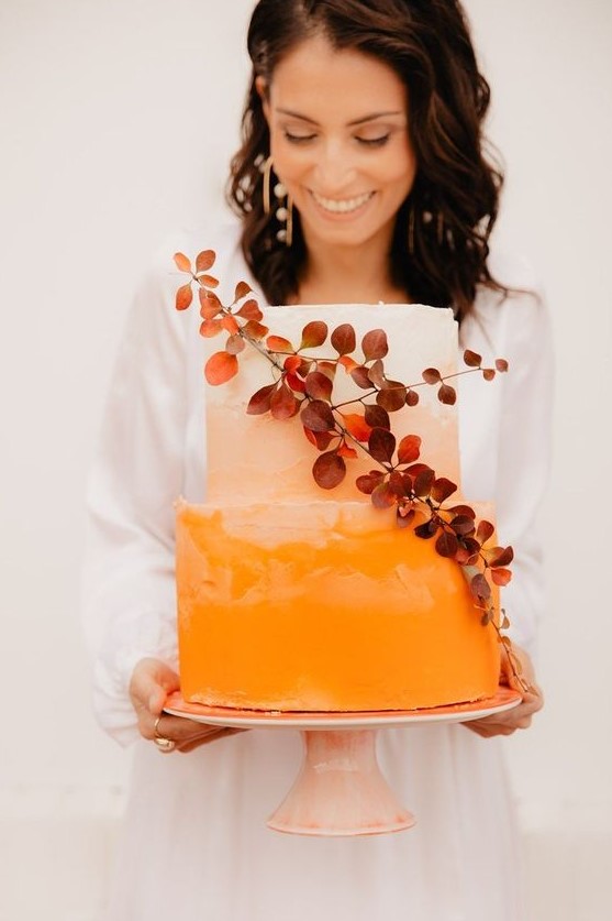 a bold orange ombre wedding cake with textural tiers and bold foliage is amazing for a bright fall wedding
