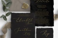 a bold wedding invitation suite of handmade paper, with black invites and a grey envelope, with gold calligraphy and a seal