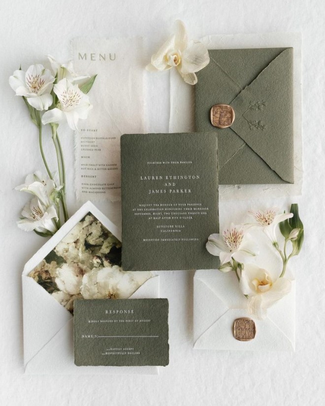 a botanical green and white wedding invitation suite with handmade paper envelopes, seals and modern lettering, with floral lining