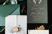 a chic fall wedding invitation suite with an emerald envelope, an acrylic and usual paper invitation with botanical prints and a vellum jacket with a seal