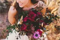 a gorgeous jewel tone wedding bouquet of fuchsia, deep purple and pink blooms and greenery is an amazing idea with much texture and a catchy shape