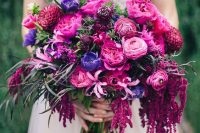 a jaw-dropping wedding bouquet of hot pink, fuchsia and purple blooms and greenery is an amazing idea for the fall