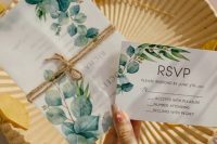 a neutral botanical print wedding invitation suite with simple black lettering, a vellum jacket with twine is a lovely idea