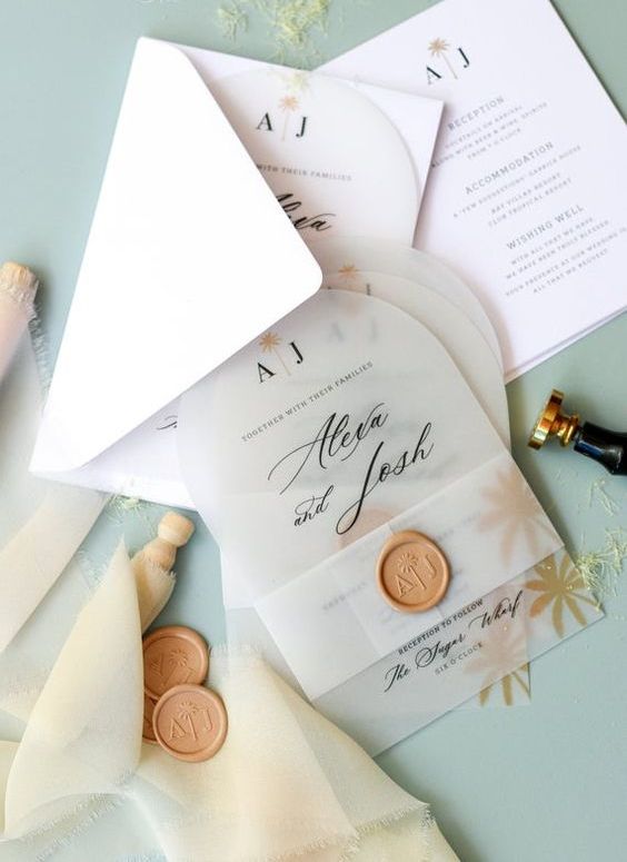a stylish modern wedding invitation suite with a white envelope, arched vellum invites with a gold seal is amazing
