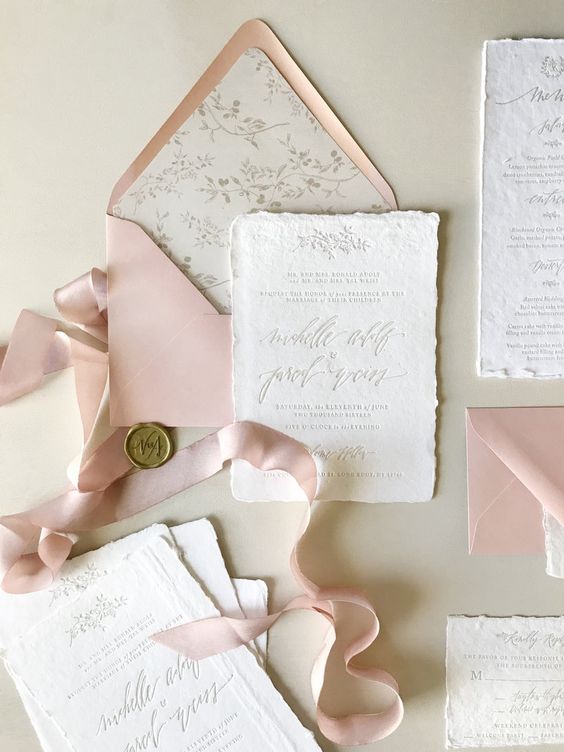 a subtle and neutral wedding invitation suite with blush and white pieces, botanical prints and calligraphy is a beautiful idea for spring