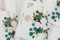wedding invitations placed into floral vellum jackets and with elegant pink seals are amazing for a delicate spring or summer wedding