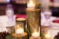 06 a lovely forest wedding centerpiece of tree stumps and branches, with moss, pinecones and candles is a cool idea to realize yourself