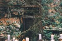 41 gorgeous woodland wedding decor decor of tree stumps with candles, moss and small white blooms plus wooden hearts