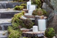 47 woodland wedding stairs decor with moss, tree slices and tree stumps, vine and moss balls and pillar candles