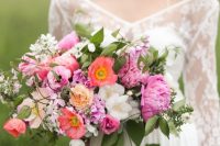 a beautiful wedding bouquet of coral and white poppies, pink peonies, peachy blooms, greenery and white bouquet fillers