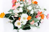 a cool wedding bouquet of white, pink, orange and coral poppies is all you need for a spring or summer wedding
